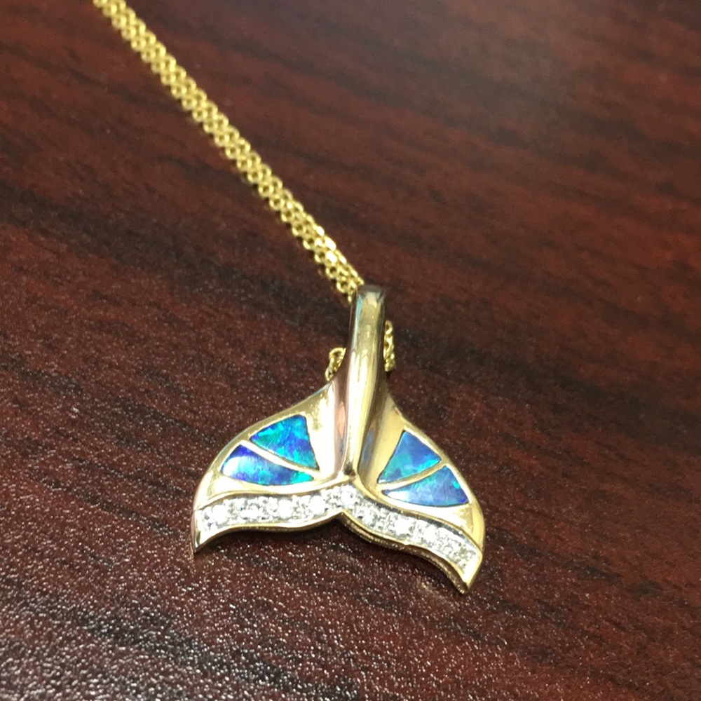 14K gold opal and diamond whale tail.